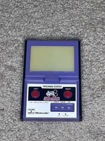 Original Game and Watch Disney Mickey Mouse handheld System.