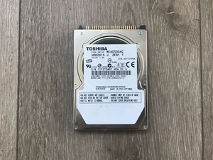Toshiba MK6050GAC HDD2G15 J ZK01 T 60 GB 2,5" 9,5 MM IDE 44 PIN disco rigido computer portatile - Foto 1 di 4