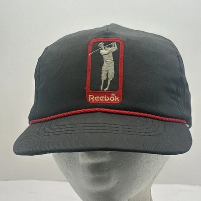 Gorra de golf Reebok vintage estilo correa trasera ajustable negra cuerda roja RARA Foto 1 de 4