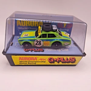 Aurora AFX G-Plus Rally Ford ESCORT 28 HO SLOT CAR Lime Green Euro Case Nr Mint - Picture 1 of 15