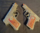 pair of vintage champ diecast cap pistols