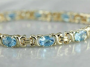 9 Ct Oval Cut Lab Created Blue Topaz Women's Tennis Bracelet Yellow Gold Plated - Picture 1 of 8