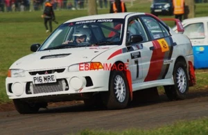 PHOTO STEVE CHAMBERLAIN PUSHES HIS MITSUBISHI EVO 4 HARD AROUND THE SPECIAL STA - Picture 1 of 1