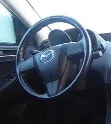 2010-2013 Mazda Mazda 3 LH Driver Steering Wheel Airbag OEM - Image 1 of 2