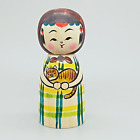 Japanese wooden doll small kokeshi  girl holding tabby cat
