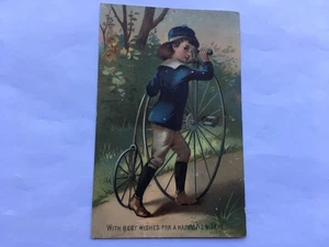 C1880s-90s VINTAGE BOY WITH PENNY FARTHING BICYCLE HAPPY NEW YEAR CARD - Foto 1 di 2