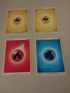 4 pokemon cards- 2 yellow, 1 red, 1 blue - Picture 1 of 2