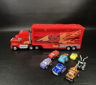 Disney Pixar Cars Mini Racers Lot Diecast & Mack Truck Hauler / Storage +7 Cars - Image 1 of 4