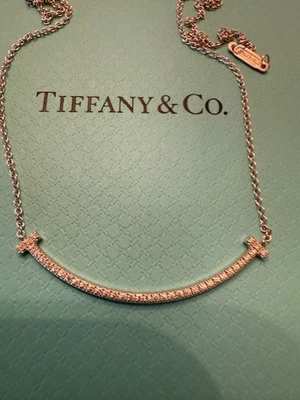 $3,900  TIFFANY & CO. T SMILE DIAMOND 18K WHITE GOLD SMALL NECKLACE PENDANT - Image 1 of 4