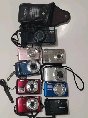 9 Sanyo Kodak Nikon Lumix Digital Film Cameras Parts Repair Power shot Coolpix - Image 1 of 4