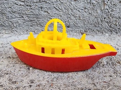 Silbato de barco de juguete de plástico LIONAL de colección de los años 50 4 1/4" de largo barco rojo y amarillo Foto 1 de 3