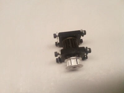 Quick Worldwide Quick 30 Pro RC Helicopter Counter Gear Shaft & Bearing Blocks - Image 1 of 4