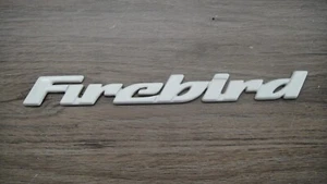 1993-2002 PONTIAC FIREBIRD OEM INTERCHANGEABLE DOOR SCRIPT EMBLEM - WHITE - Picture 1 of 2