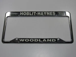 Vintage NOS Hoblit-Haynes Dodge-Jeep Woodland CA Metall Nummernschild Rahmen Etikett - Bild 1 von 3