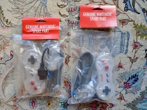 2 OEM Dog Bone controllers "Genuine Nintendo Spare Part" new w/bags NES Nintendo - Picture 1 of 10