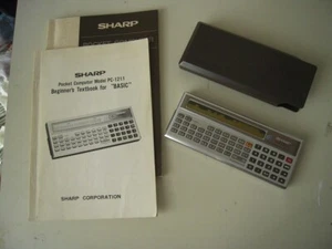 Sharp PC-1211 (non funzionante) con astuccio e manuali - Afbeelding 1 van 3