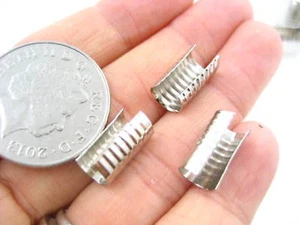 20 piezas plata 7*13 Cilíndrico acanalado retorno cable extremo tapa envolvente punta puntas plegables - Imagen 1 de 4