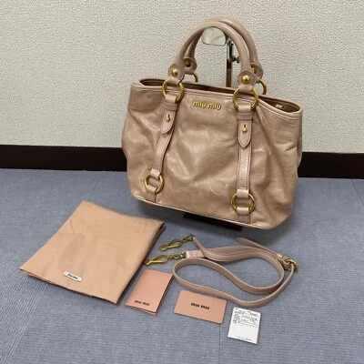 Bolsa bidirecional Miu Miu em couro rosa, madras, com bolsa de armazenamento - Imagem 1 de 4