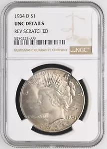 1934-D TONED $1 PEACE SILVER DOLLAR - NGC UNC DETAILS "REV SCRATCHED" - Picture 1 of 2