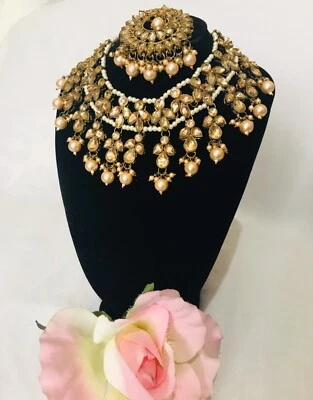 nacklace set gold stone with gold pearl with beautiful maangtika and earings  - Image 1 of 4