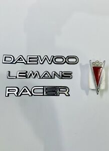 DAEWOO, LEMANS And RACER Emblem In Metal with Grill Logo Set Of 4 Piece