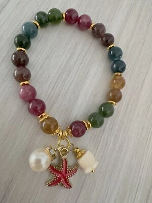 Lucky Wish Jade Pulsera Elástica con Cuentas con Flor de Lirio Blanco Perla Rojo Cáscara Foto 1 de 4