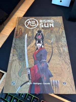 RISING SUN Comic Book - Hard Cover Graphic Novel (CMON)  - Image 1 of 2