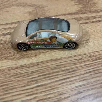 Matchbox die-cast car featuring  Go, Diego, Go! tan 2004 Mitsubishi Eclipse. - Image 1 of 4