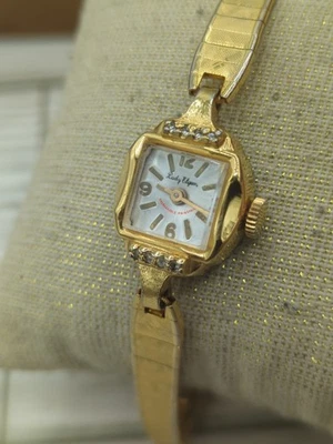 Reloj de cuerda Lady Elgin tono dorado detalles diamantes vintage Foto 1 de 4
