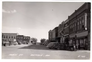 BUFFALO MISSOURI HAUPTSTRASSE RPPC POSTKARTE UM 1940ER JAHRE AUTO SCHILDER - Bild 1 von 3