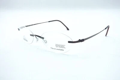 Monturas de gafas sin montura Adidas rojas A619 6057 52 19 135 exhibición de tienda Foto 1 de 4