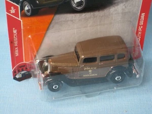Matchbox 1933 Plymouth PC sedán coche de policía marrón juguete modelo 70 mm de largo en EE. UU. BP - Imagen 1 de 2