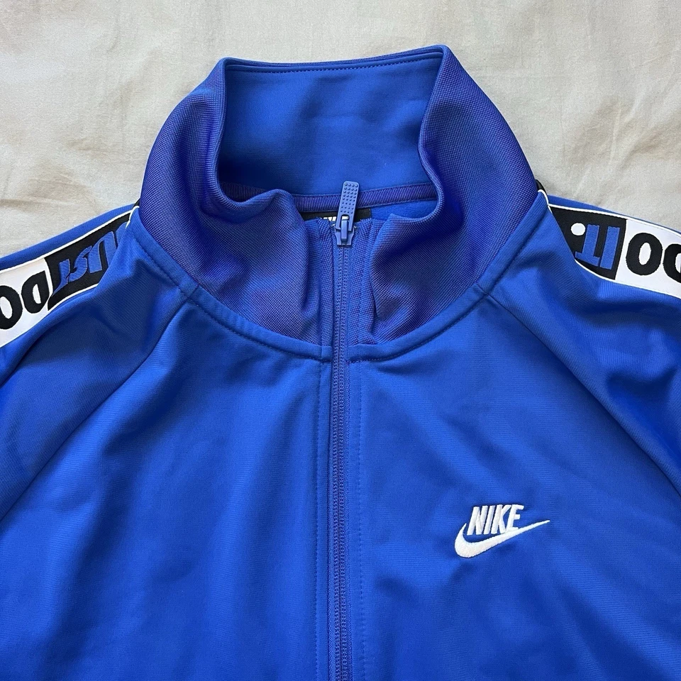 耐克男式田径夹克大号蓝色Just Do It胶带标志全拉链口袋 — 第 1/4 张图片
