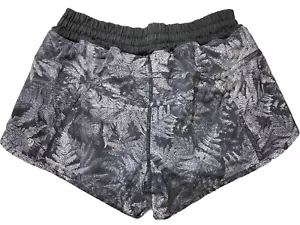NUOVO! Pantaloncini Lululemon Hotty-Hot neri stampa felce tasca zip taglia 4 elasticizzati - Foto 1 di 7