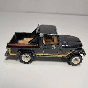 Hot Wheels 1982 Jeep Scrambler Truck 1/64 Diecast Black W/Orange, Yellow Stripes - Picture 1 of 10