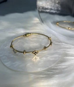 Armreif Armband 14 Karat vergoldet schwarz Kleeblatt Edelstahl Magnetverschluss - Bild 1 von 7