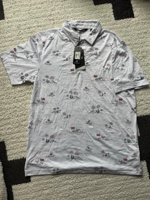 NUEVO CON ETIQUETAS POLO TRAVIS MATHEW LAKE BREAK PARA HOMBRE, GRANDE PARA HOMBRE CON LOGOTIPO DE ERIN HILLS EN LA MANGA Foto 1 de 4