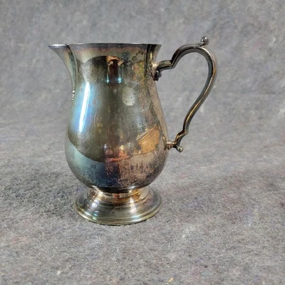 Crema con patas plateada Oneida vintage mango ornamentado 2,5"×4"×4" Foto 1 de 4