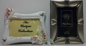 A pair of 2" x 3" picture frames one metal, one ceramic - Picture 1 of 6