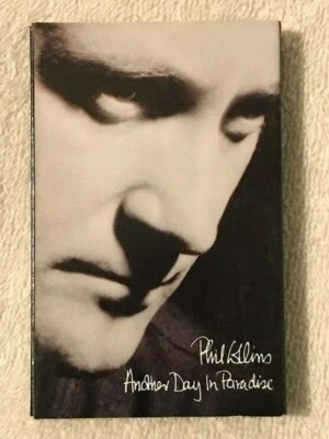 ~PHIL COLLINS~ANOTHER DAY IN PARADISE~USED CASSETTE~ - Image 1 of 4