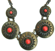 Brass tone chain necklace, patterned circles with red bead centres bib