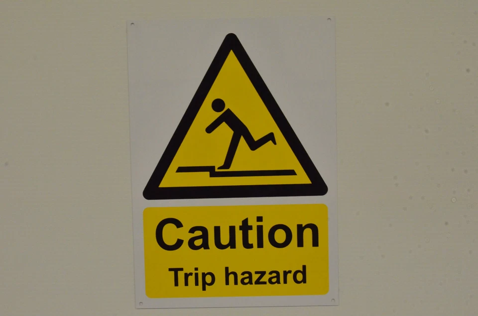 CAUTION TRIP HAZARD A4 sign or sticker step stairs uneven surface slip hazard