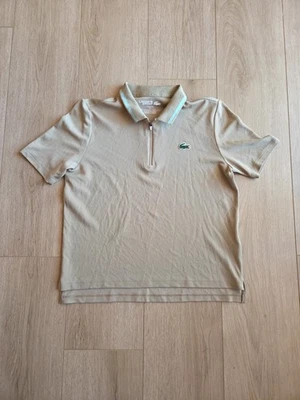 Polo de tenis de golf Lacoste para mujer calce holgado protección UV elástico tostado talla pequeña 36 Foto 1 de 4