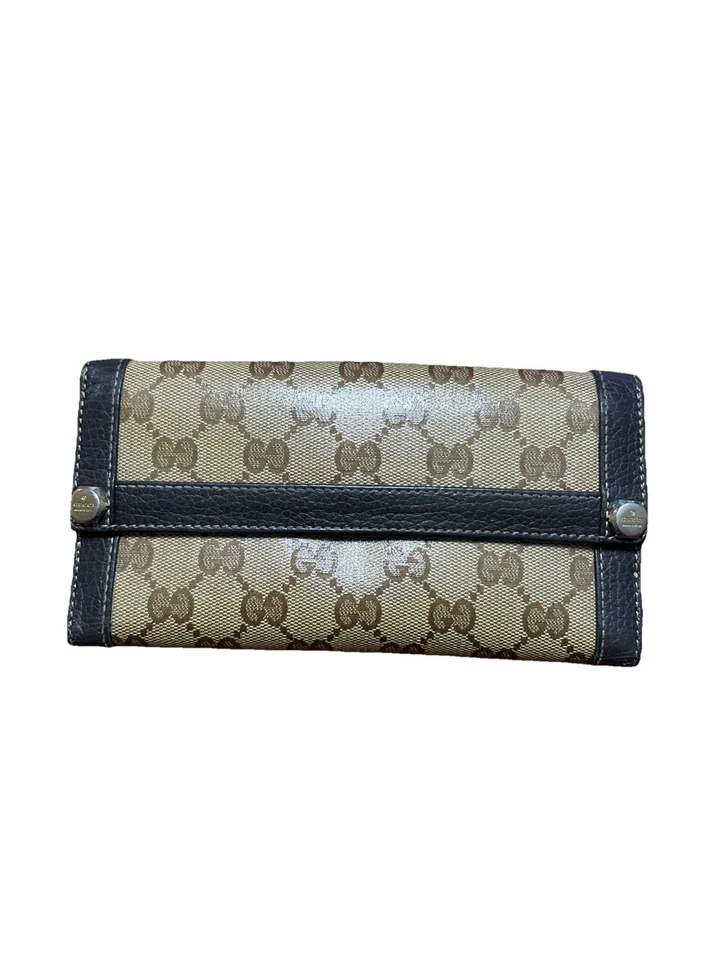 Cartera larga Gucci GG monograma lona con ribete de cuero. Foto 1 de 4