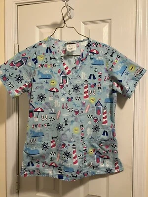 💗💗💗 Blusa Médica UA Playa Faro Náutico Sol Azul Claro XS 💗💗💗 Foto 1 de 3