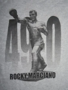 Camicia ROCKY MARCIANO 49-0 BROCKTON BLOCKBUSTER Undefeated Heavyweight Champ 2XL - Foto 1 di 4