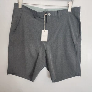 Pantaloncini corti ibridi Free Fly da uomo nuovi con etichette taglia 36 x 9 grigio grafite chino elasticizzati - Foto 1 di 11
