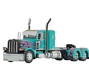 1/64 DCP TEAL/BLACK/PINK PETERBILT 389 W/ 36" SLEEPER - Picture 1 of 4