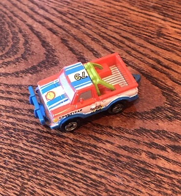 Micro Machine Datsun Pickup Truck Red/White/Blue/Orange Shell # 79 Bonus Vehicle - Image 1 of 4