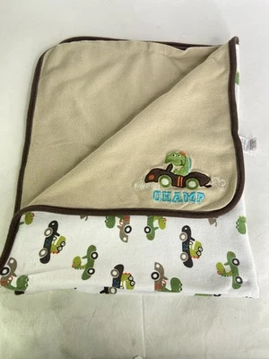 Manta bebé algodón Carters Mommys Champ Dinosaurios Coches Marrón Verde Blanco Foto 1 de 4